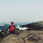 man on rocky coastline